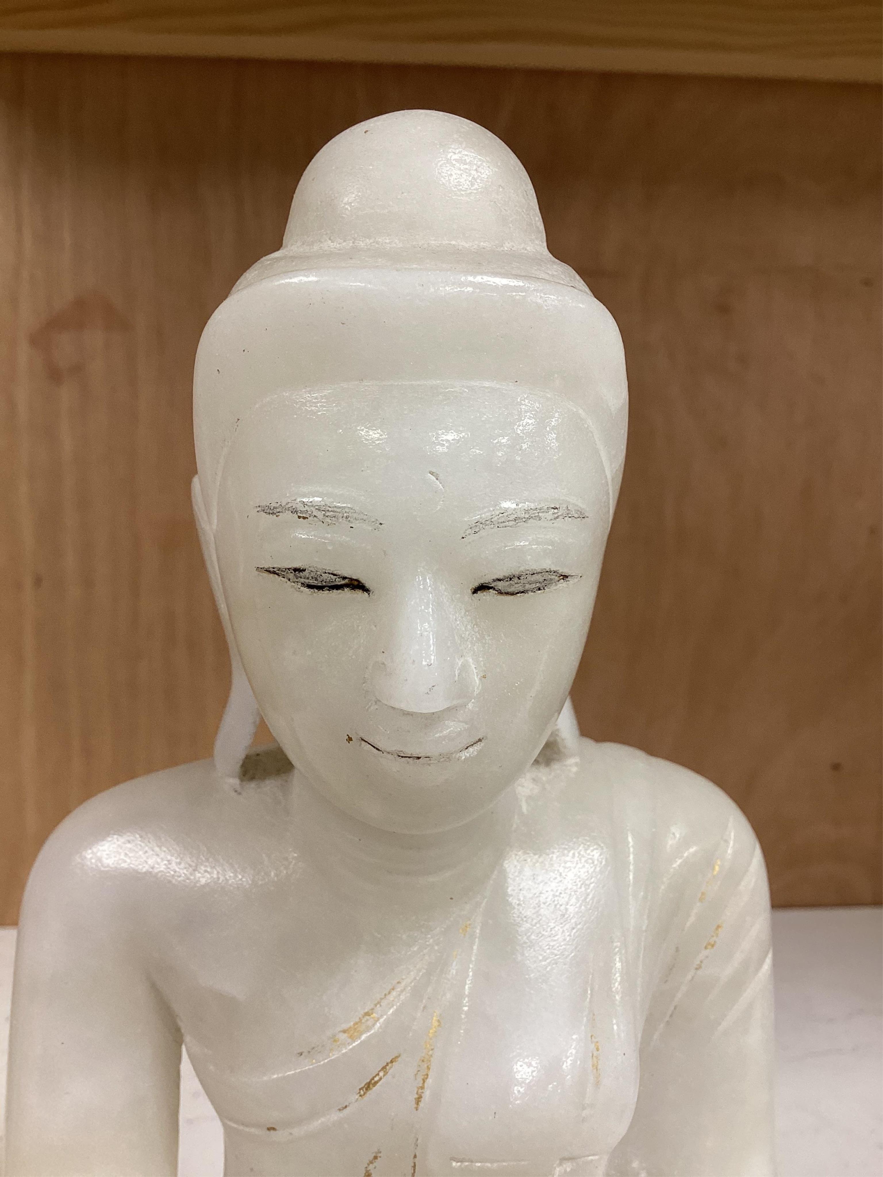Two modern jade figures, together with a marble Buddha and a carved giltwood figure, largest 24cm wide
